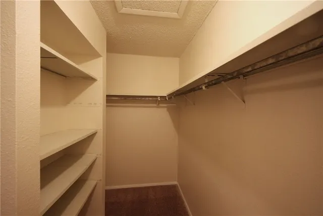 a bathroom with a shower and a glass door