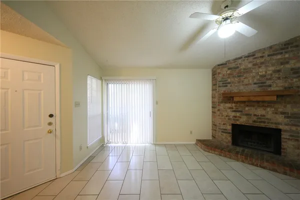 wooden floor fireplace and entryway in a room