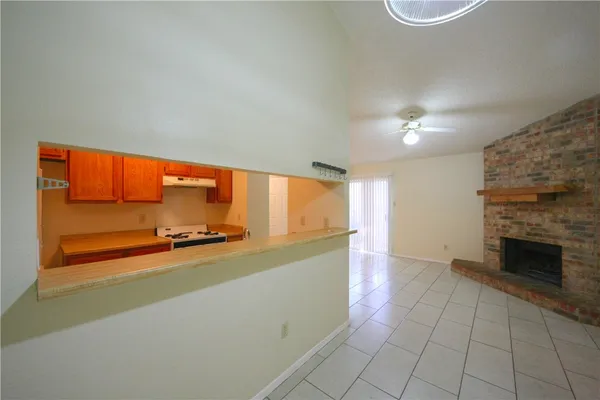 a kitchen with a sink appliances and cabinets