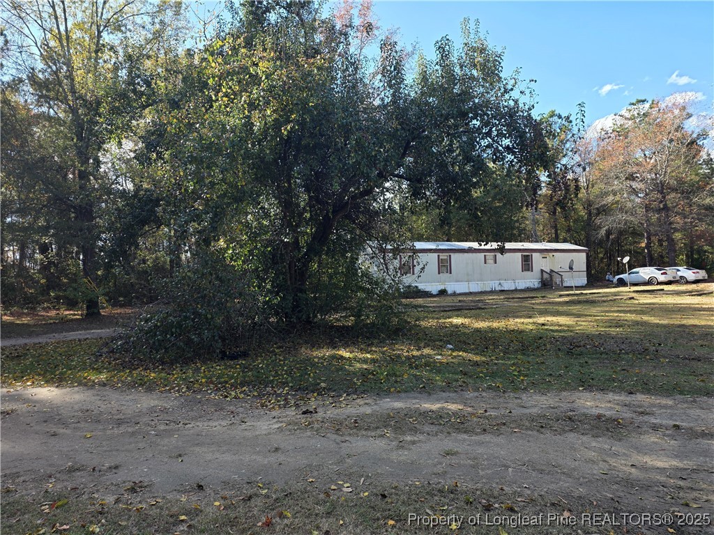 409 Burns Road Lumberton, NC 28358 - Photo 13 of 16 a view of a water fountain with large trees
