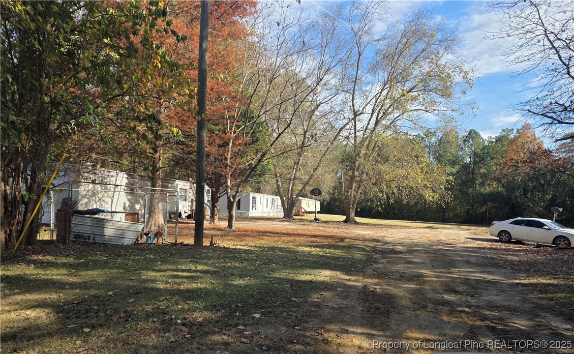 409 Burns Road Lumberton, NC 28358 - Photo 15 of 16 a view of road with trees