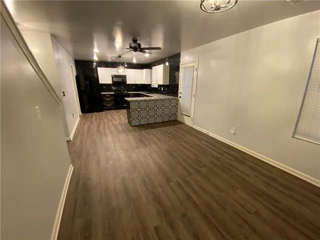 a view of kitchen with cabinets and stainless steel appliances