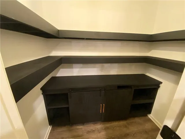 a spacious bathroom with a sink a large mirror and a shower