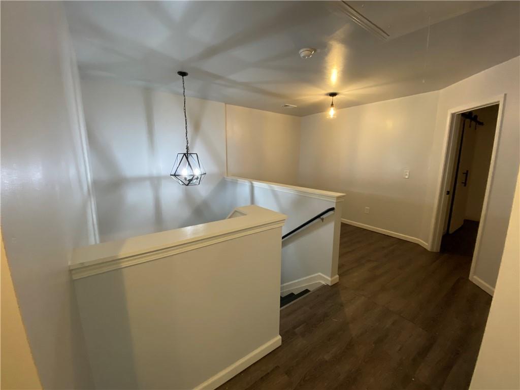 764 Dove Tree Lane Social Circle, GA 30025 - Photo 20 of 48 a view of a hallway with wooden floor