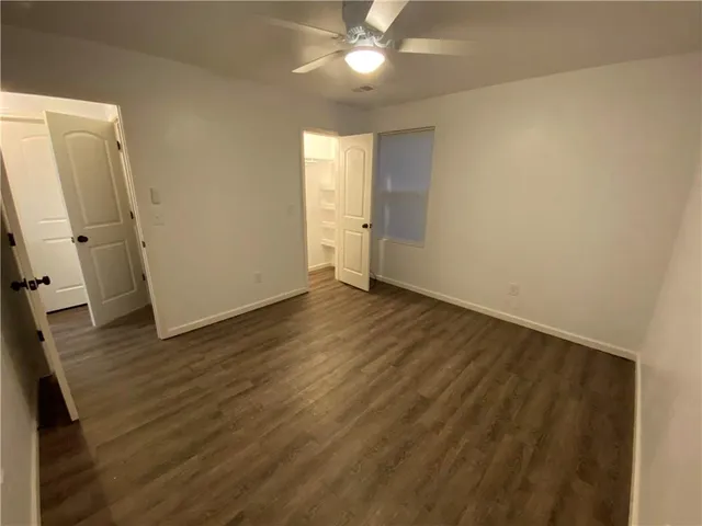 a bathroom with a double vanity sink mirror and toilet