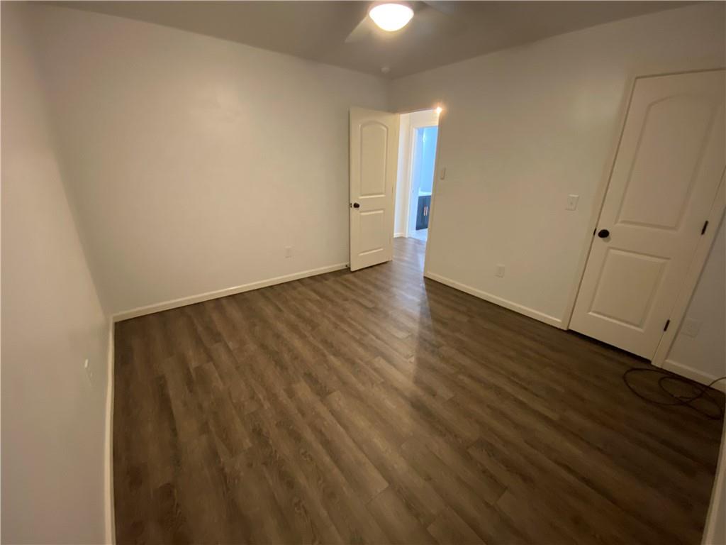764 Dove Tree Lane Social Circle, GA 30025 - Photo 28 of 48 a view of an empty room with wooden floor