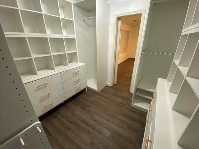 a view of balcony with wooden floor