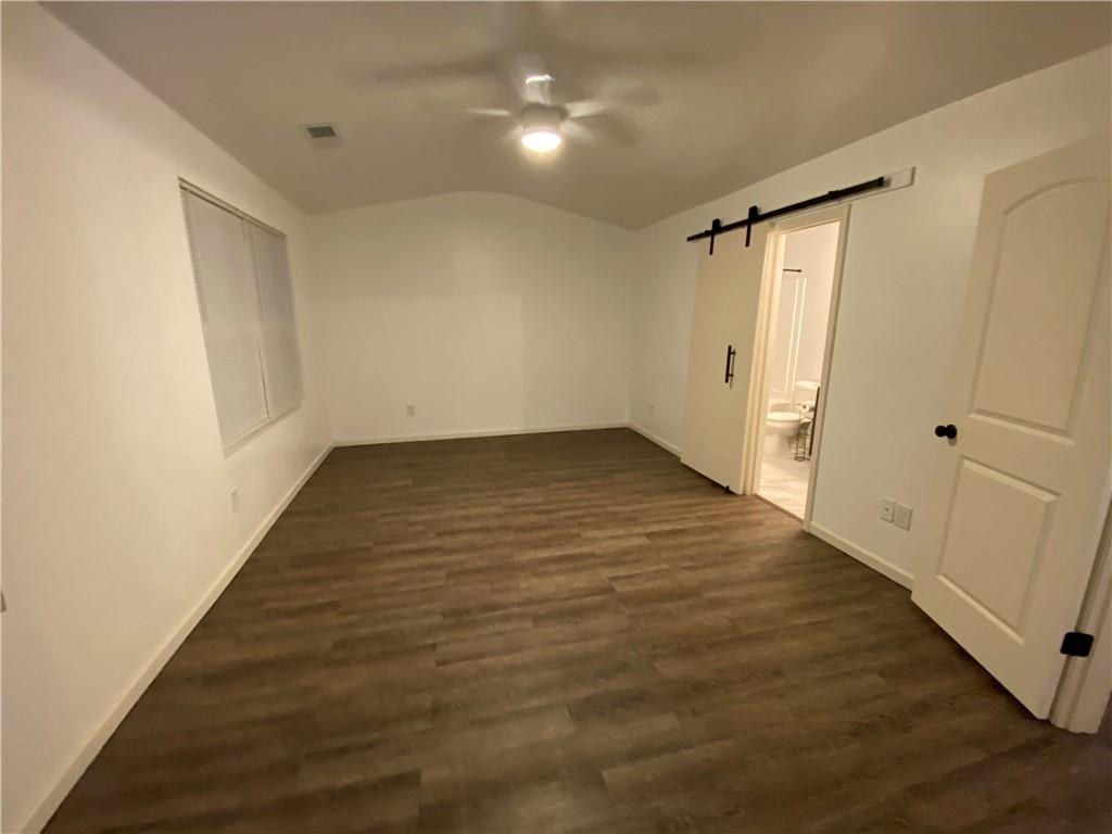 764 Dove Tree Lane Social Circle, GA 30025 - Photo 37 of 48 a view of an empty room with wooden floor