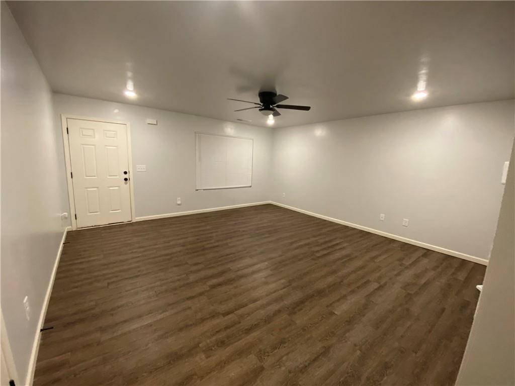 764 Dove Tree Lane Social Circle, GA 30025 - Photo 4 of 48 an empty room with wooden floor and windows