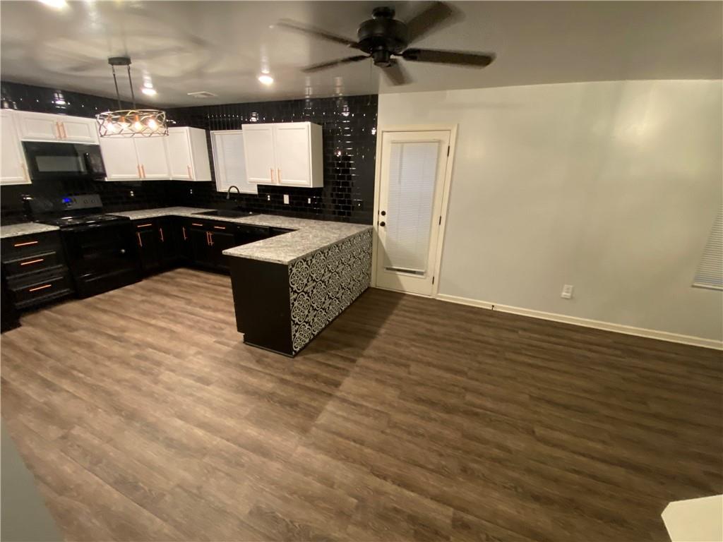 764 Dove Tree Lane Social Circle, GA 30025 - Photo 8 of 48 a large room with wooden floor