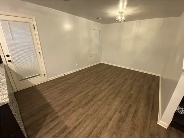 a view of a kitchen from the hallway