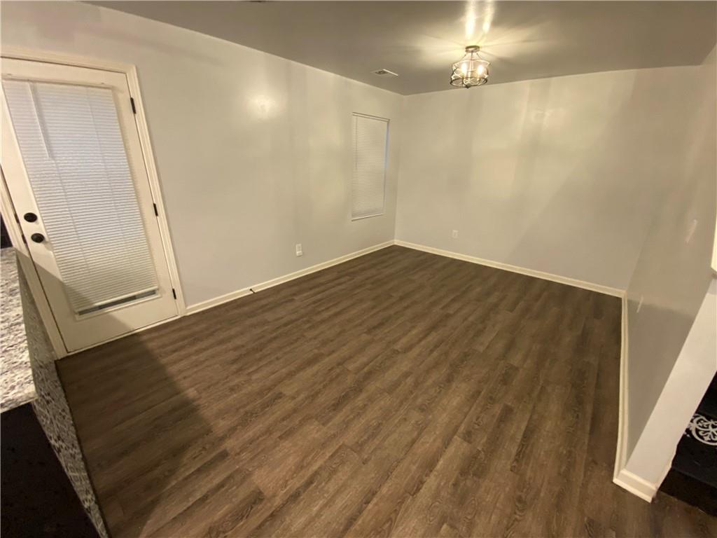 764 Dove Tree Lane Social Circle, GA 30025 - Photo 10 of 48 wooden floor in an empty room with a mirror