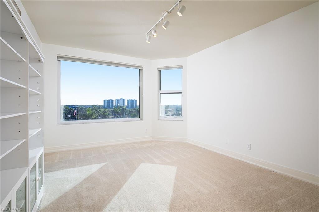 435 Dockside Drive, Unit B703 Naples, FL 34110 - Photo 24 of 38 an empty room with windows
