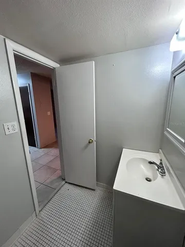 a kitchen with a refrigerator and a stove