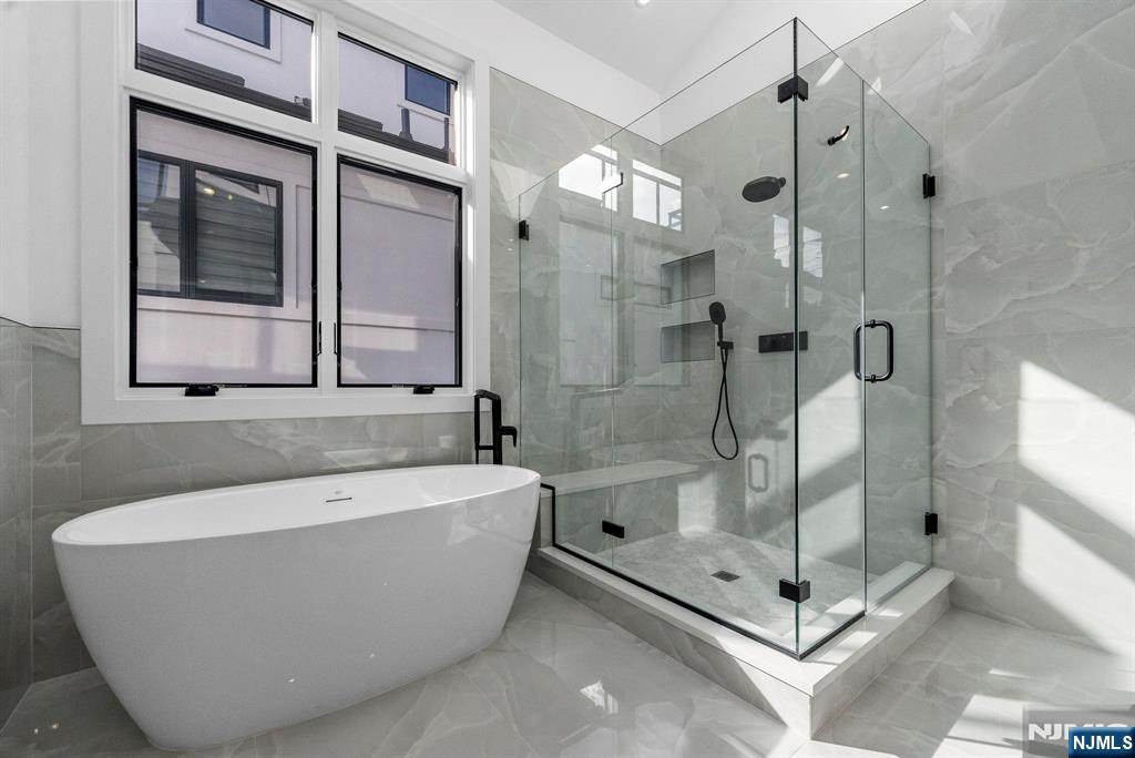 2189 Jones Road Fort Lee, NJ 07024 - Photo 17 of 33 a white bath tub sitting next to a shower