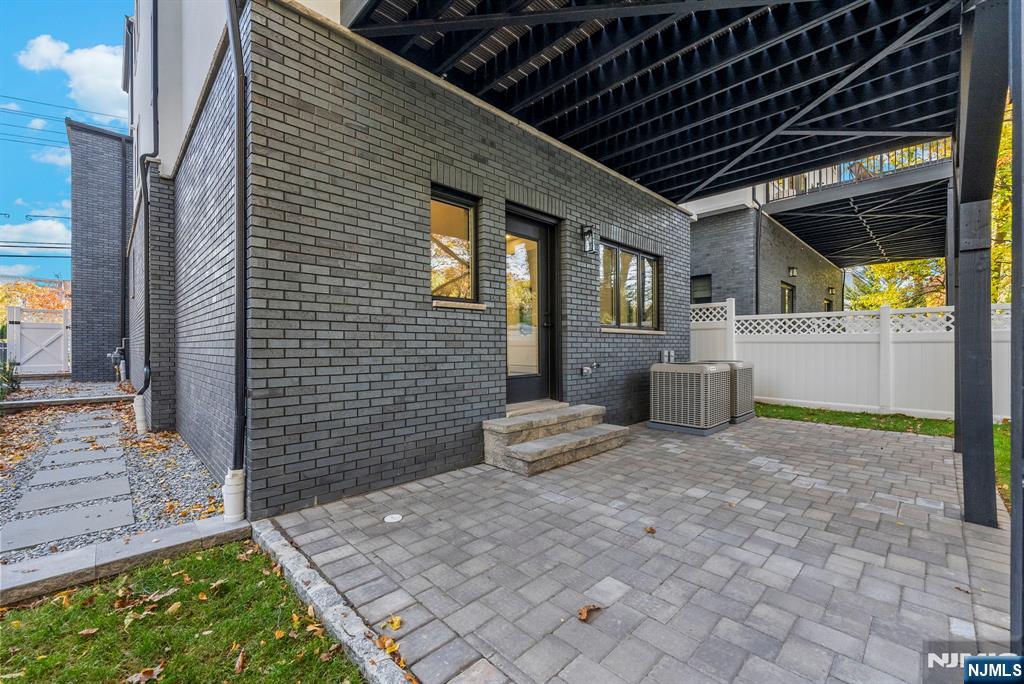 2189 Jones Road Fort Lee, NJ 07024 - Photo 31 of 33 a view of a house with backyard and porch