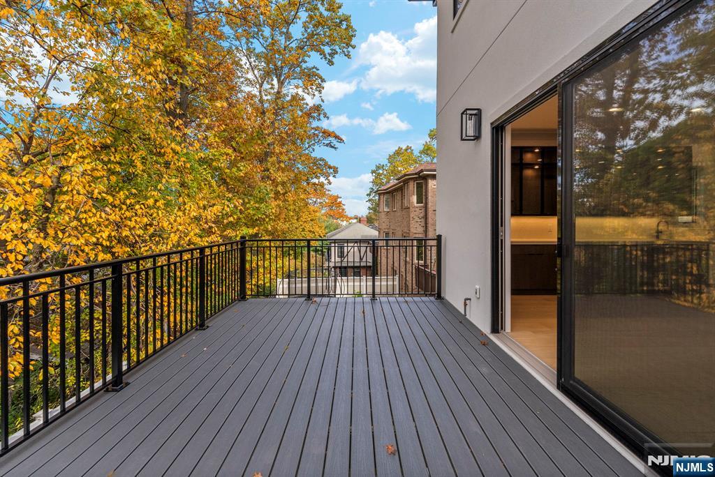 2189 Jones Road Fort Lee, NJ 07024 - Photo 32 of 33 a view of a balcony with wooden floor and fence
