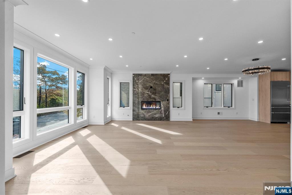 2189 Jones Road Fort Lee, NJ 07024 - Photo 6 of 33 a view of an empty room with a fireplace