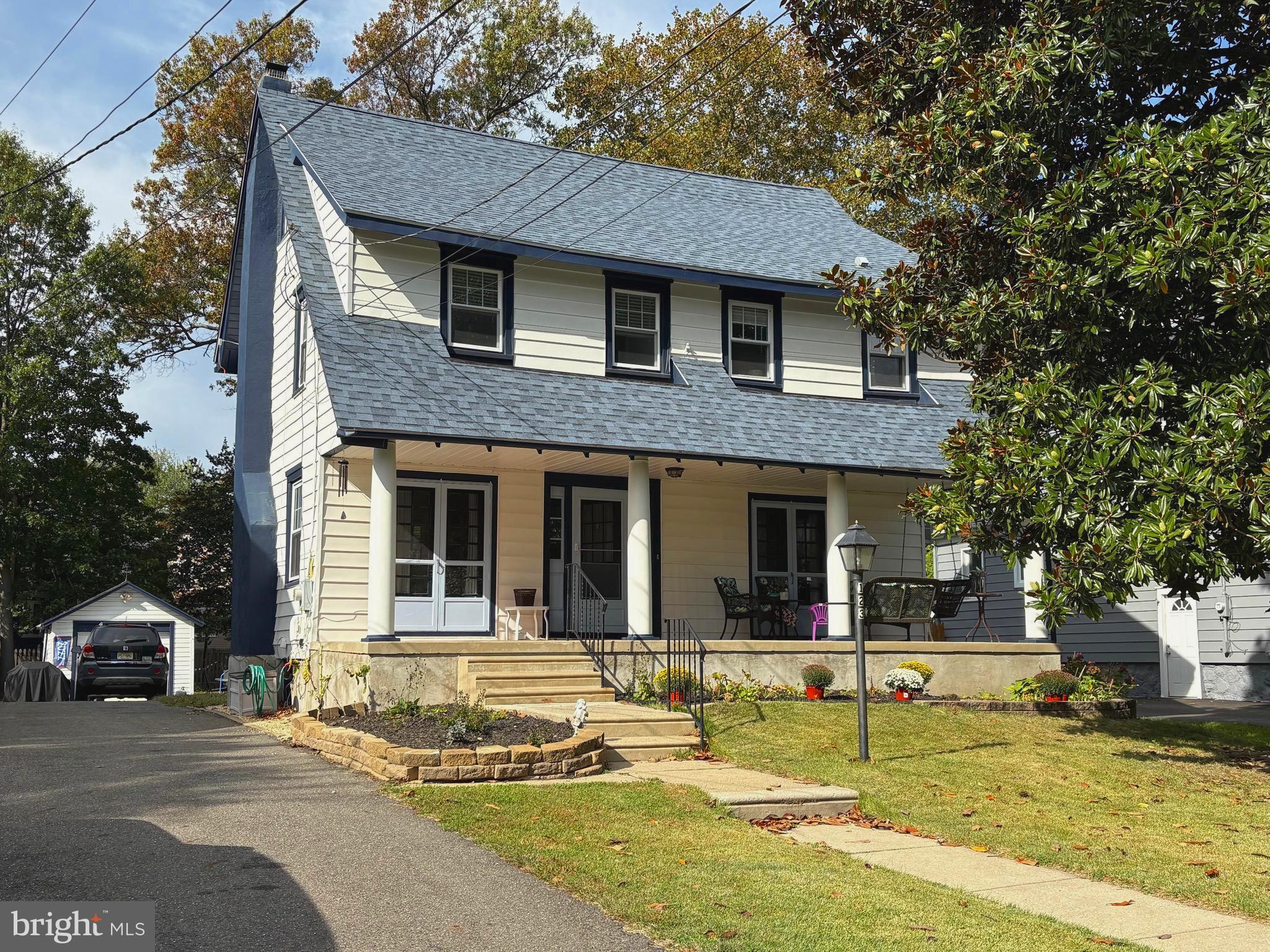Exterior front with open porch and French doors