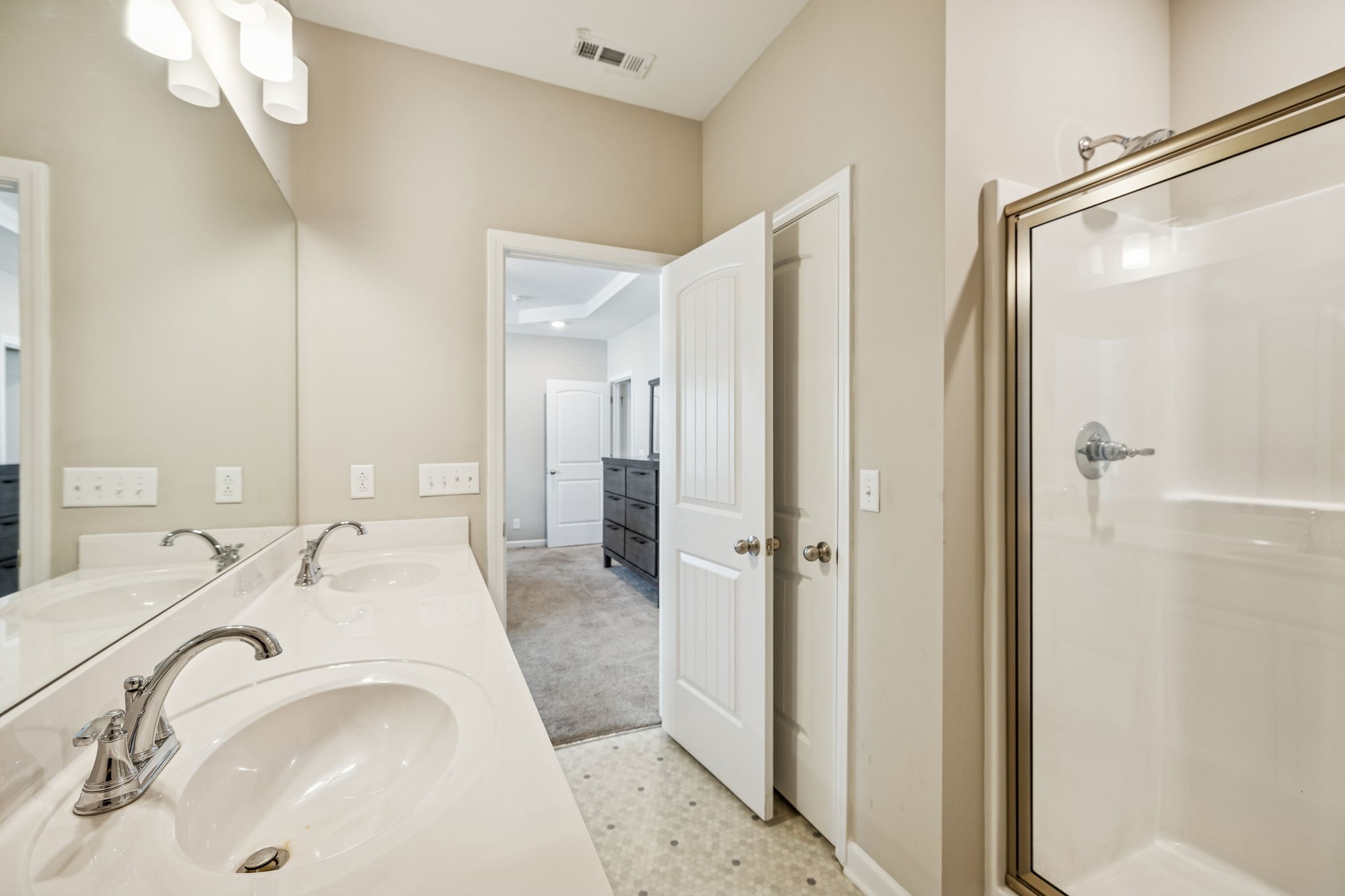501 Ruby Cate Way Murfreesboro, TN 37128 - Photo 12 of 27 a en suite bathroom with a sink a mirror and a shower