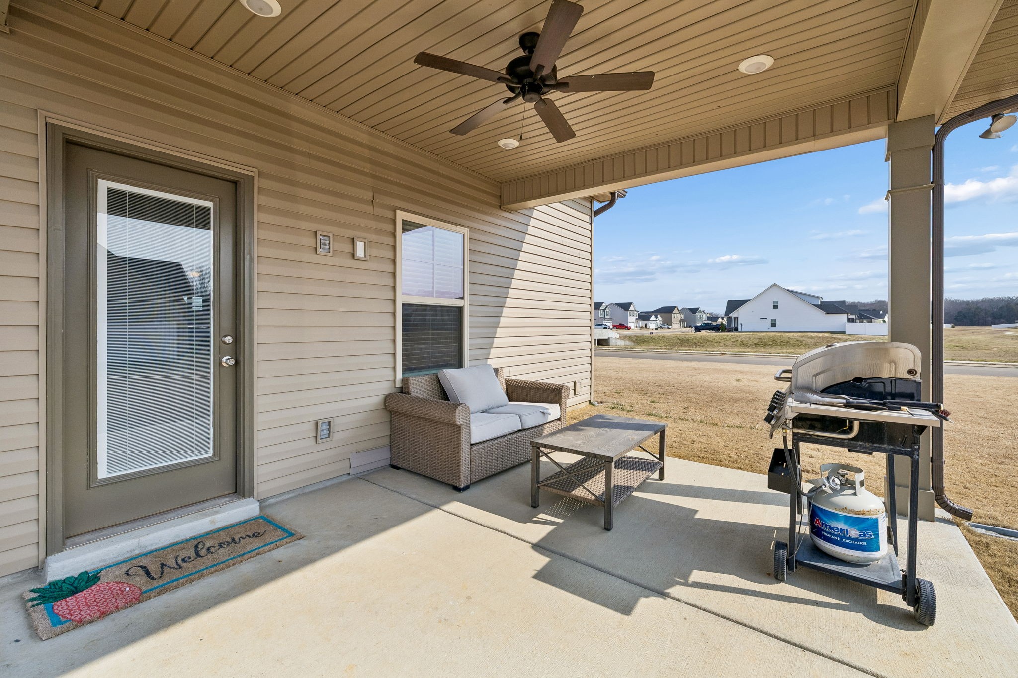 501 Ruby Cate Way Murfreesboro, TN 37128 - Photo 20 of 27 a living room with patio furniture and a floor to ceiling window