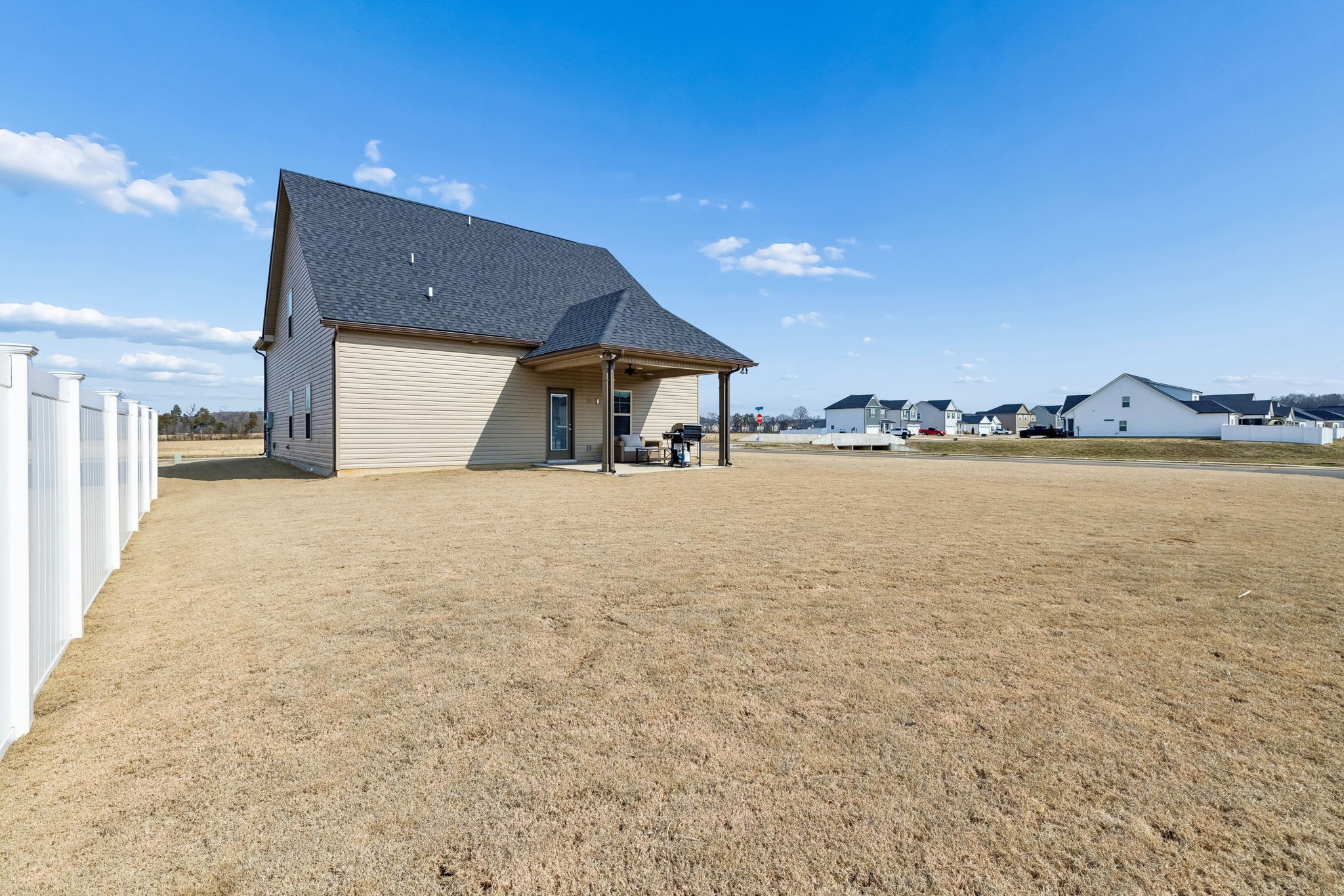 501 Ruby Cate Way Murfreesboro, TN 37128 - Photo 24 of 27 a view of a patio with table and chairs a barbeque with wooden fence