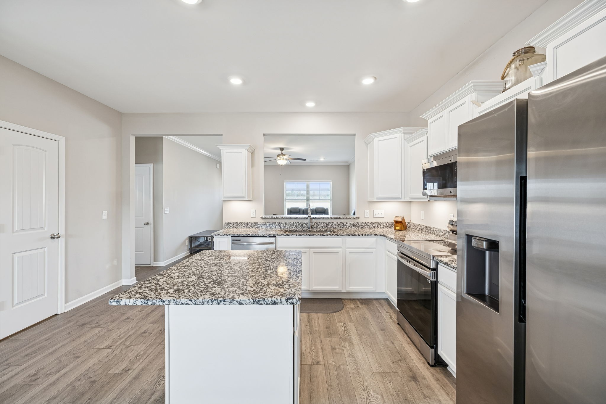 501 Ruby Cate Way Murfreesboro, TN 37128 - Photo 6 of 27 a kitchen with stainless steel appliances granite countertop a sink stove and refrigerator