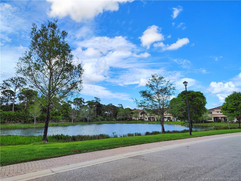 414 Southwest Walking Path, Unit 414 Stuart, FL 34997 - Photo 14 of 15 a view of a patio with a yard