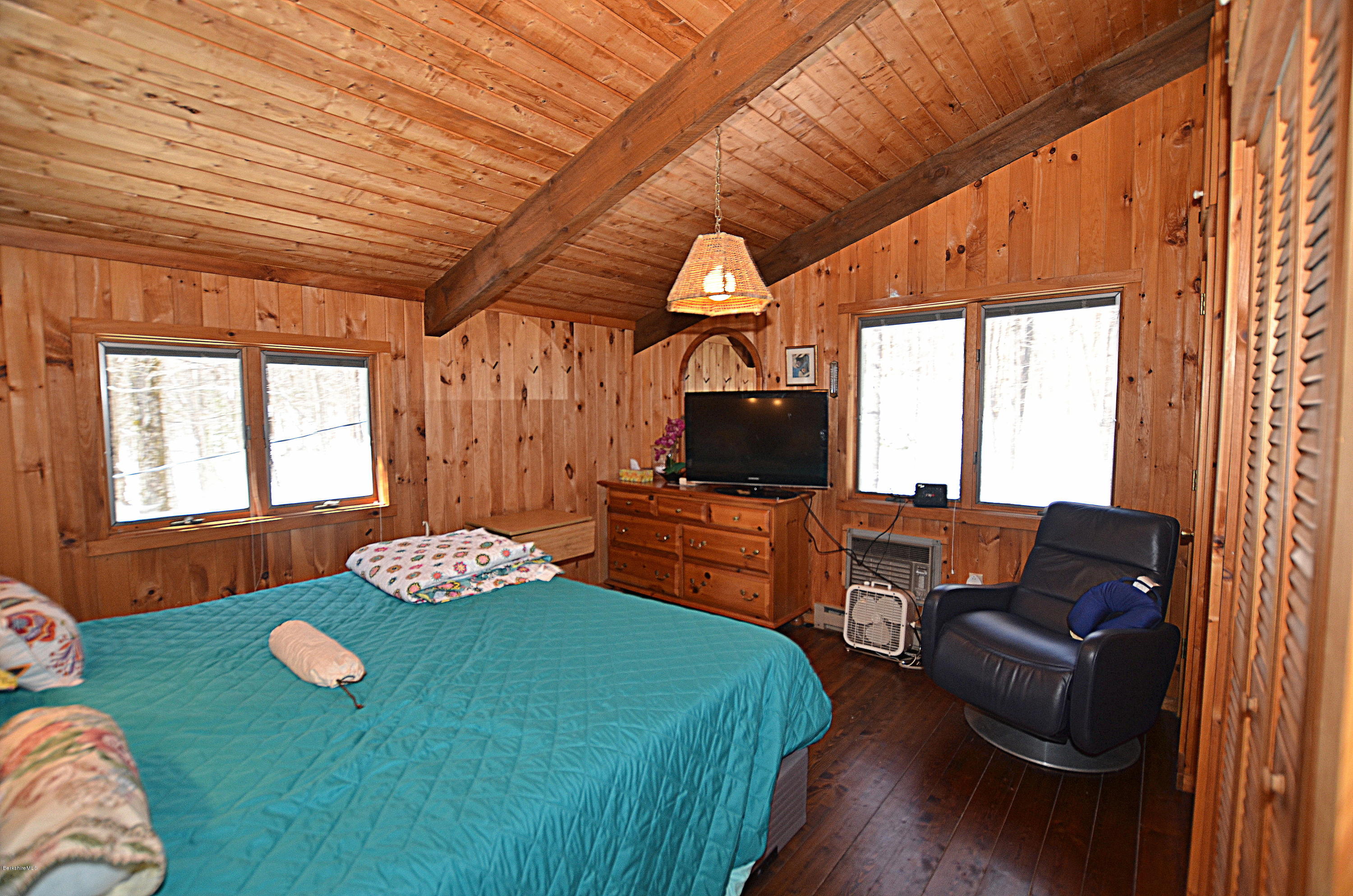 164 Moberg Road Becket, MA 01223 - Photo 14 of 25 a living room with furniture and a flat screen tv