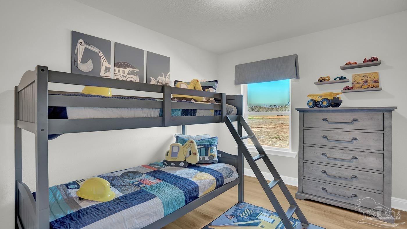 2172 Sandhill Street Cantonment, FL 32533 - Photo 10 of 30 a bed room with bed and furniture
