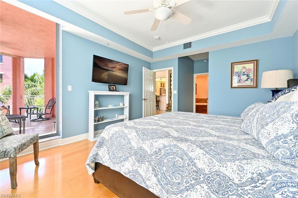 401 Bayfront Place, Unit 3301 Naples, FL 34102 - Photo 13 of 24 a bedroom with a bed and a flat screen tv