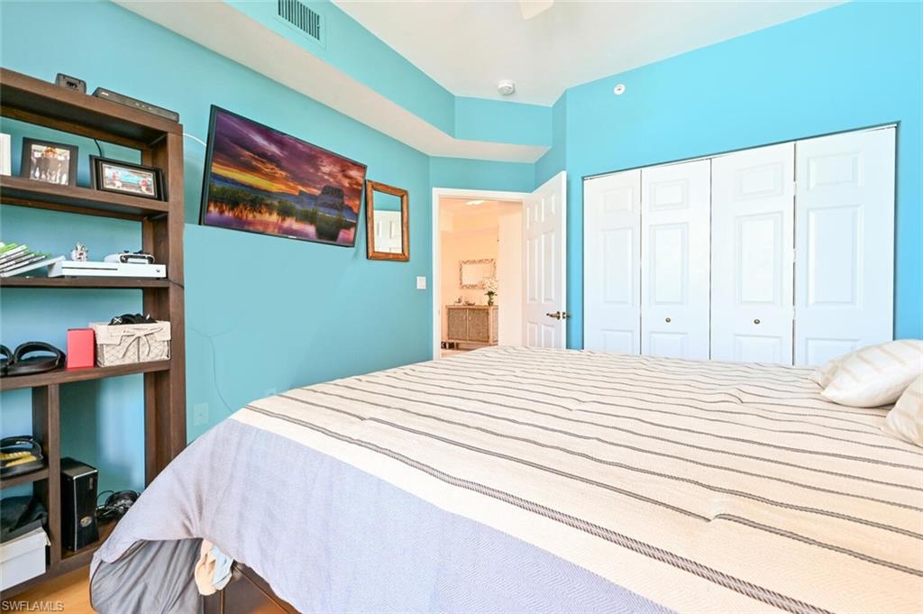 401 Bayfront Place, Unit 3301 Naples, FL 34102 - Photo 17 of 24 a bedroom with a bed and a window