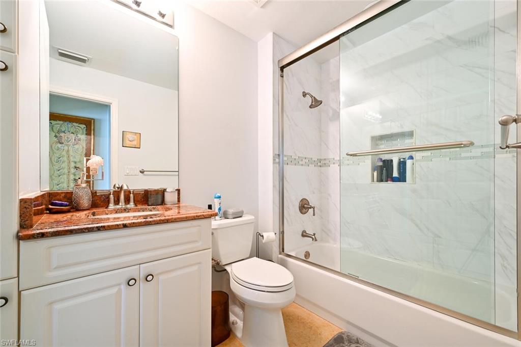401 Bayfront Place, Unit 3301 Naples, FL 34102 - Photo 18 of 24 a bathroom with a sink a toilet and shower