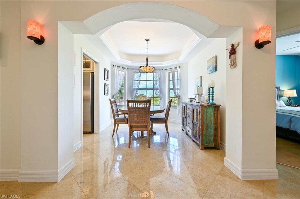401 Bayfront Place, Unit 3301 Naples, FL 34102 - Photo 2 of 24 a view of a a dining room with furniture window and wooden floor
