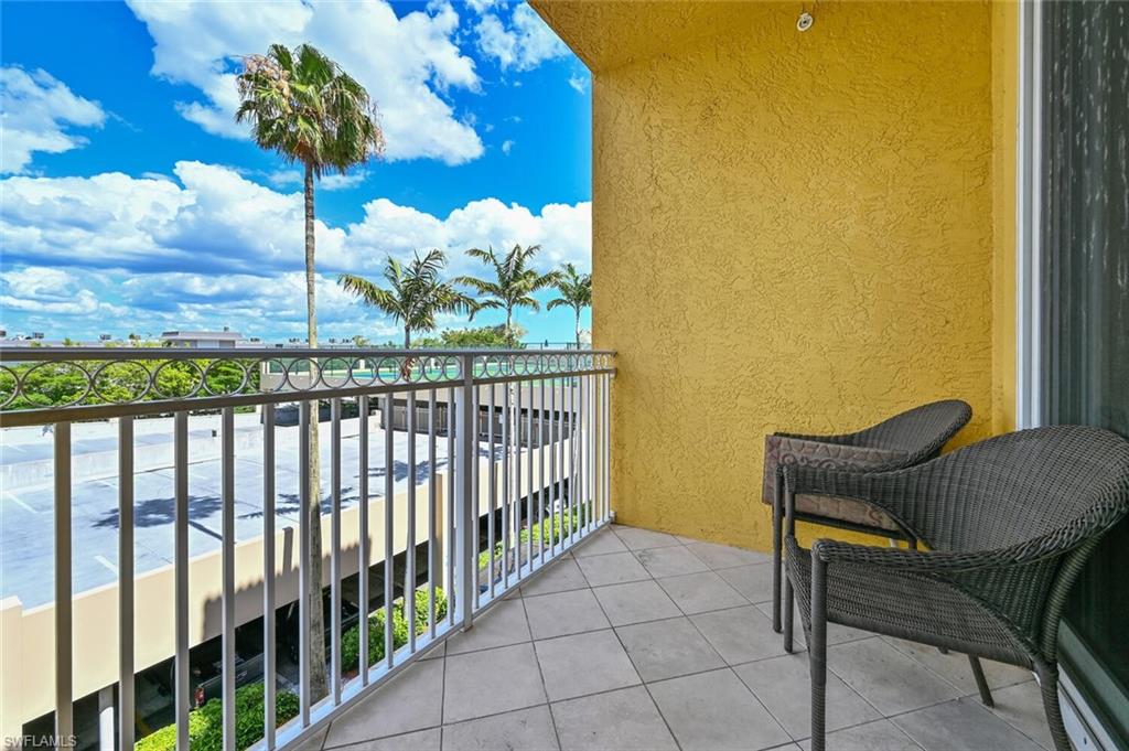 401 Bayfront Place, Unit 3301 Naples, FL 34102 - Photo 21 of 24 a view of a porch with furniture and a floor to ceiling window