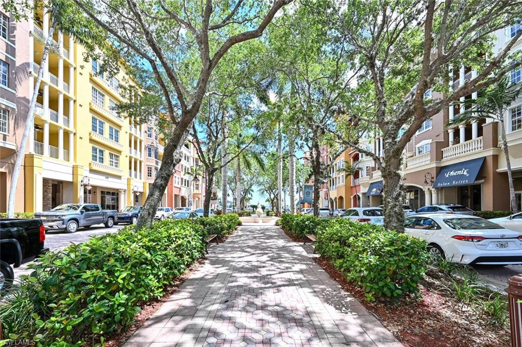 401 Bayfront Place, Unit 3301 Naples, FL 34102 - Photo 24 of 24 a front view of a building with a garden and trees