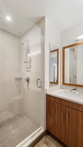 a bathroom with a shower and a sink