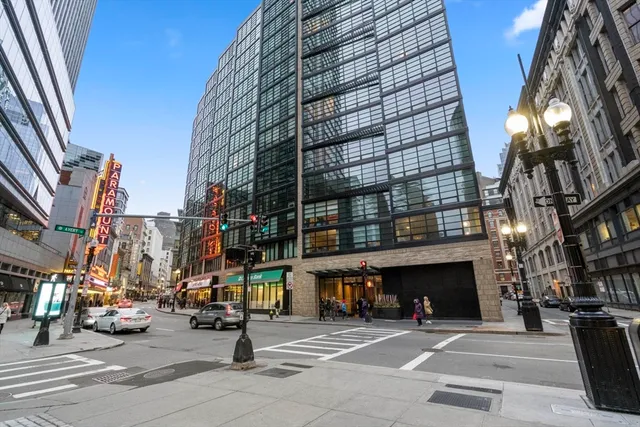 a view of a building with traffic signal lights