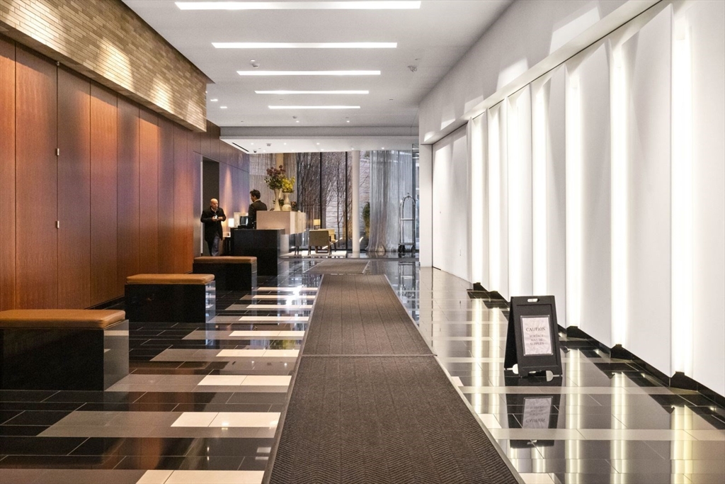 580 Washington Street, Unit 1105 Boston, MA 02111 - Photo 23 of 28 a view of a living room with windows