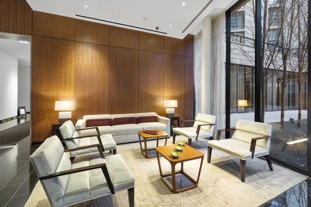 580 Washington Street, Unit 1105 Boston, MA 02111 - Photo 25 of 28 a building outdoor space with patio furniture