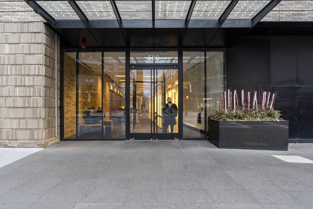 580 Washington Street, Unit 1105 Boston, MA 02111 - Photo 28 of 28 a view of an empty room with a fireplace