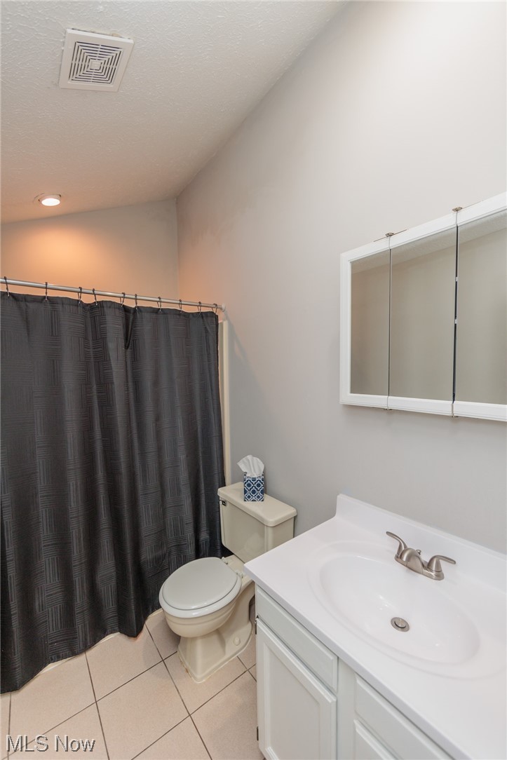 2406 Call Road Stow, OH 44224 - Photo 6 of 30 Bathroom with toilet, vanity with extensive cabinet space, and tile flooring