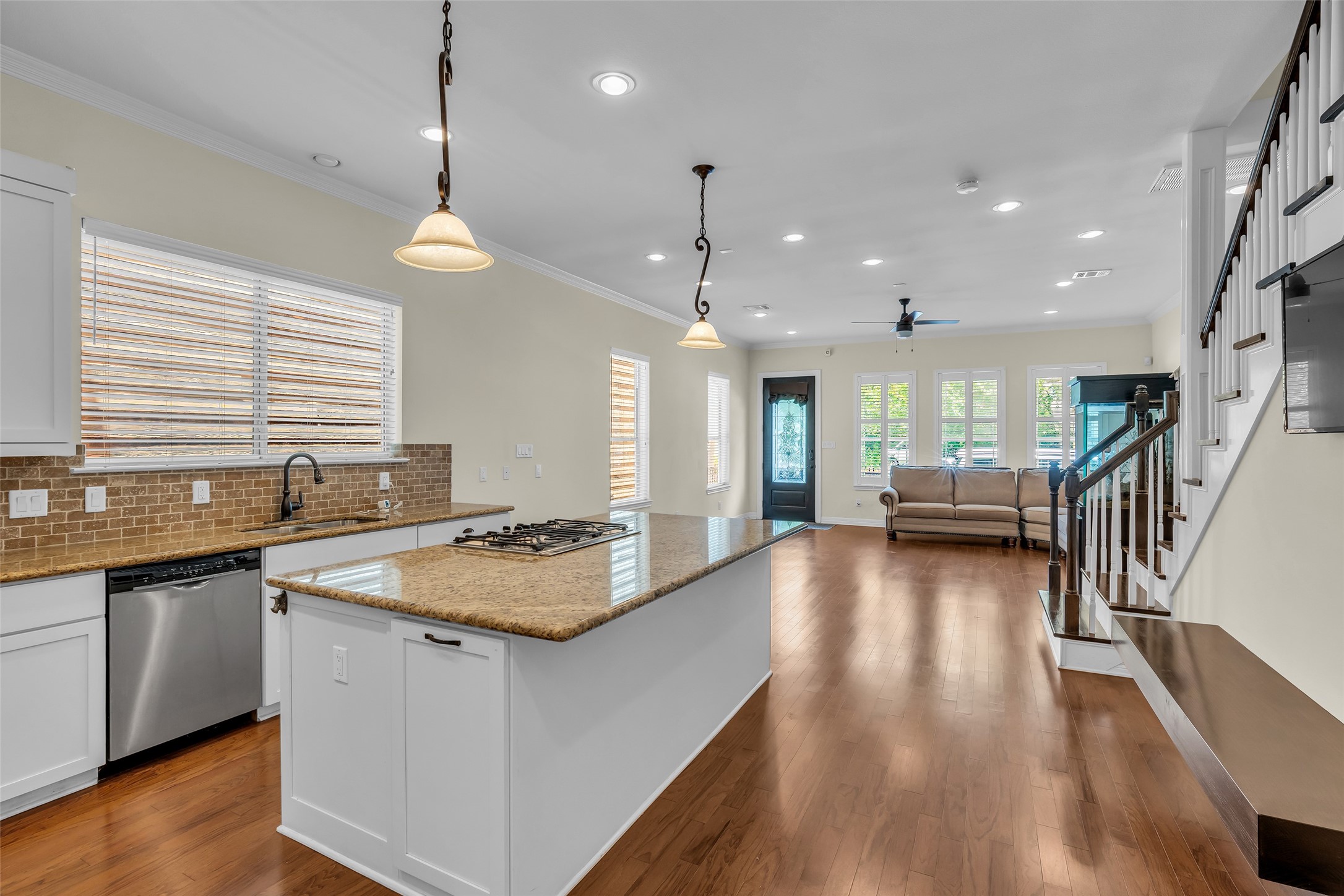 1423 Colorado Street Houston, TX 77007 - Photo 9 of 28 View from the kitchen extends all the way to the end of the living room, highlighting the open layout and continuous flow between the main living spaces.