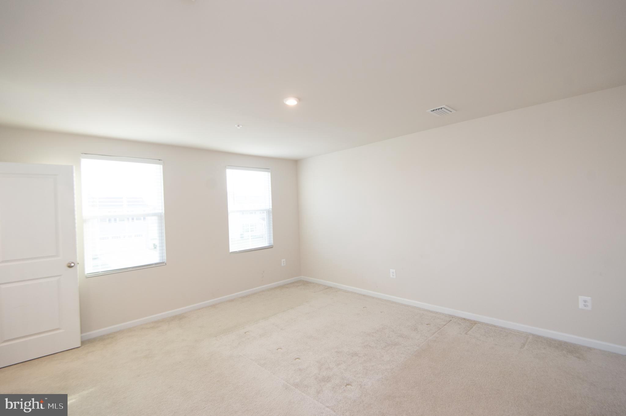 120 Mariners Way Cambridge, MD 21613 - Photo 11 of 44 an empty room with windows