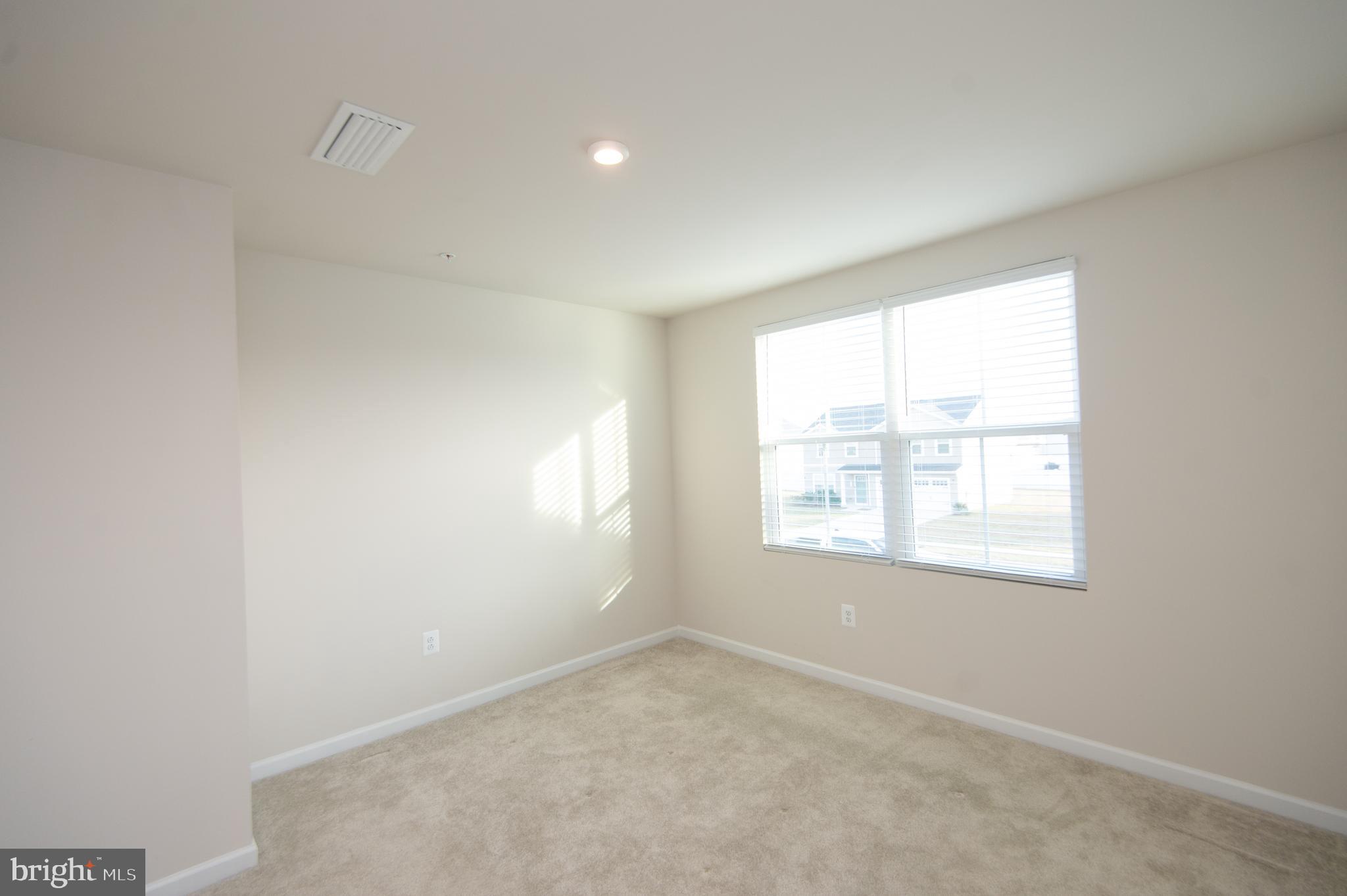 120 Mariners Way Cambridge, MD 21613 - Photo 17 of 44 an empty room with a window