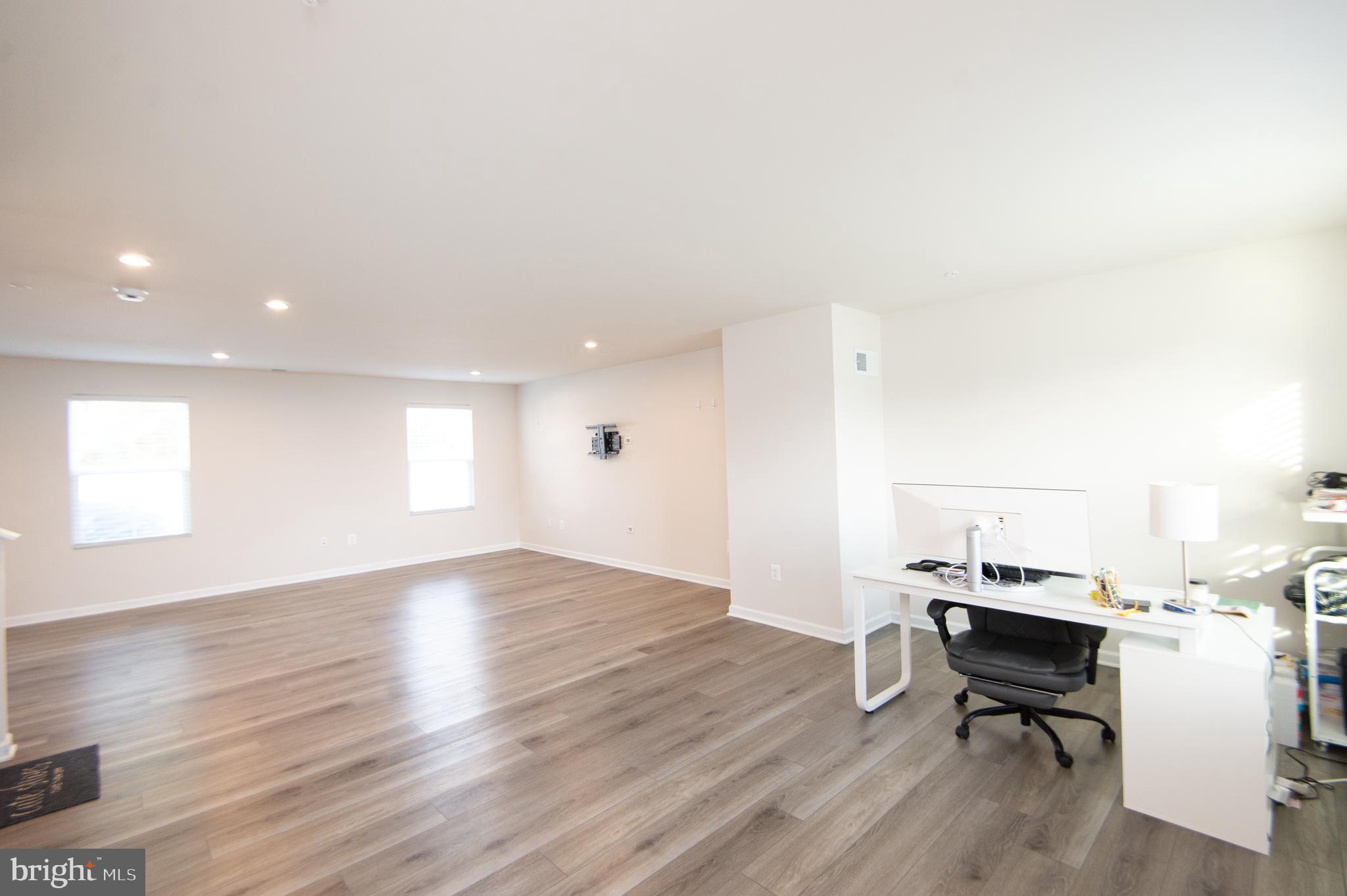 120 Mariners Way Cambridge, MD 21613 - Photo 2 of 44 a workspace with wooden floor and a cabinet