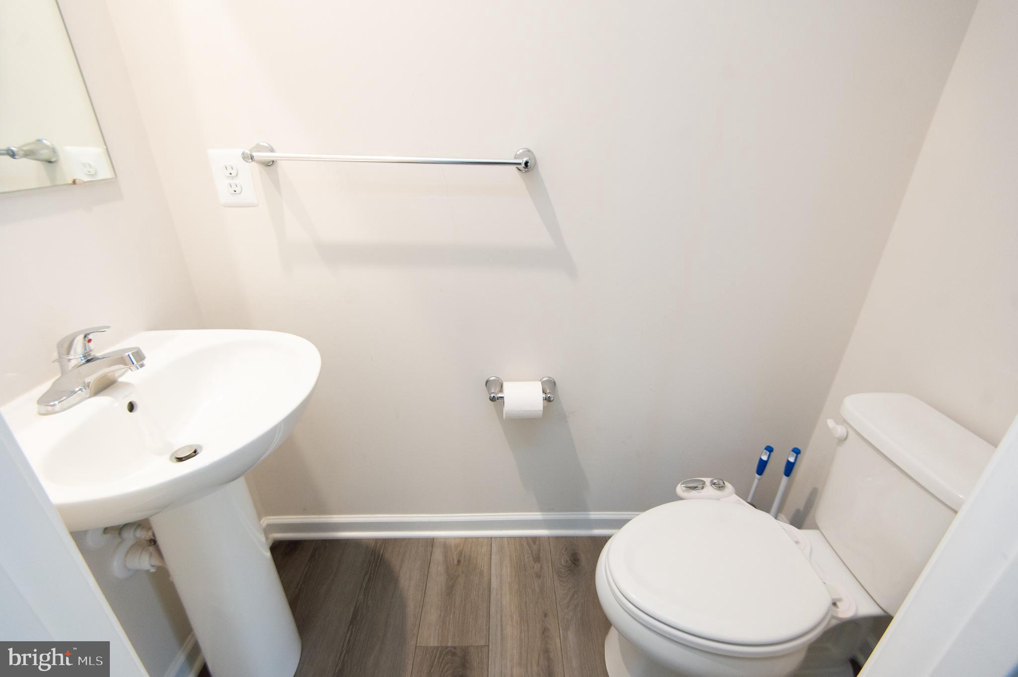 120 Mariners Way Cambridge, MD 21613 - Photo 5 of 44 a white toilet sitting next to a bathroom sink