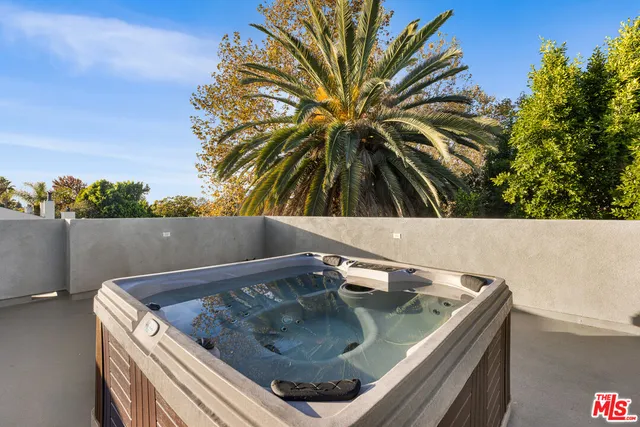 a bedroom with a large bed and a large window