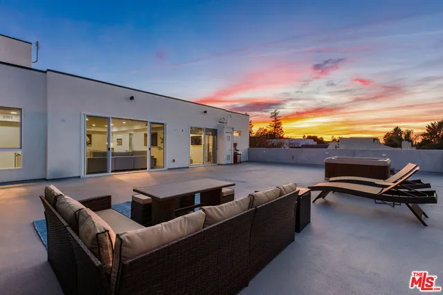 a bedroom with a bed and a night stand