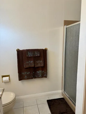 a bathroom with a toilet a sink and a mirror